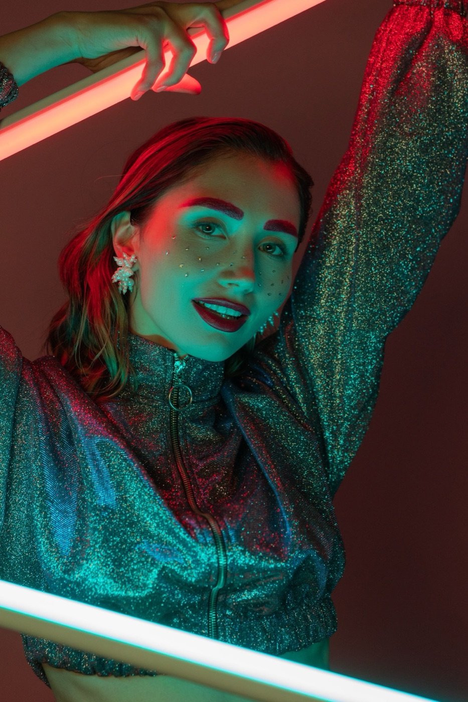 A face in glitter, looking straight out